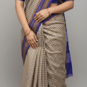 Woman wearing a beige and royal blue handloom cotton check saree with gold zari border.
