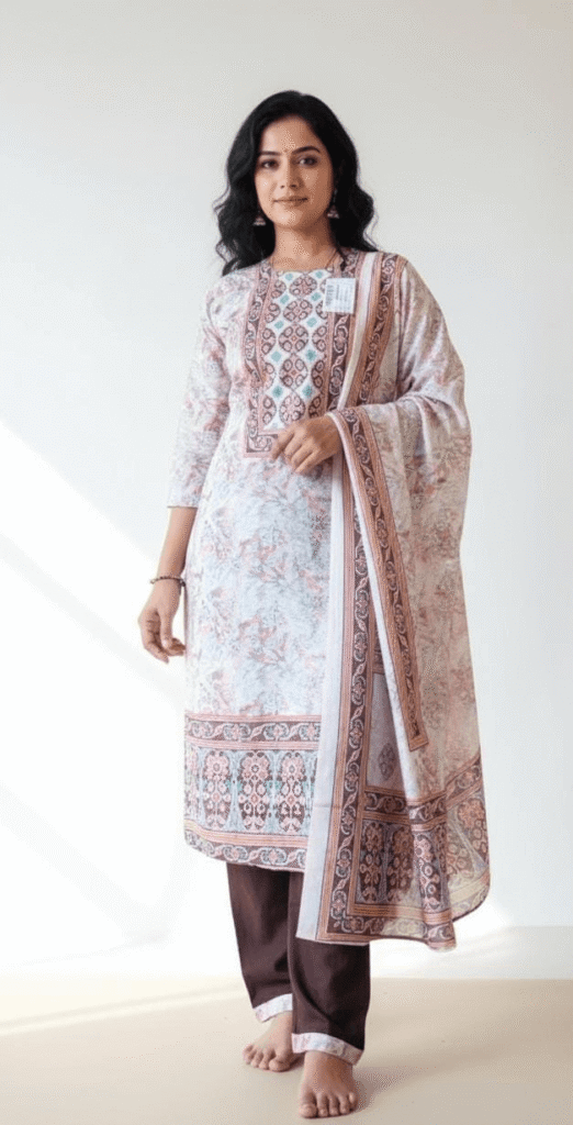 Women's maroon cotton straight kurta set featuring blue floral thread embroidery and matching trousers.