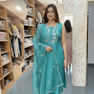 Classic three-piece Salwar Kameez set in a vibrant shade of teal or seafoam green