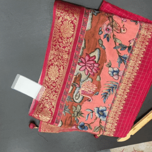 elegant printed saree with zari border features a soft peach-pink base